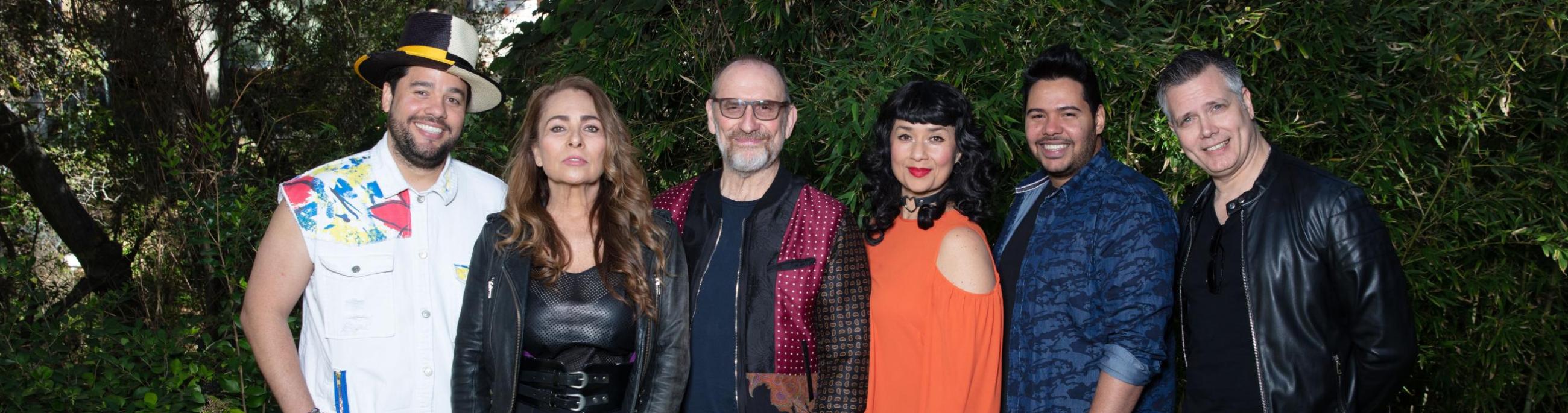 Four men and two women face the camera with seriousness