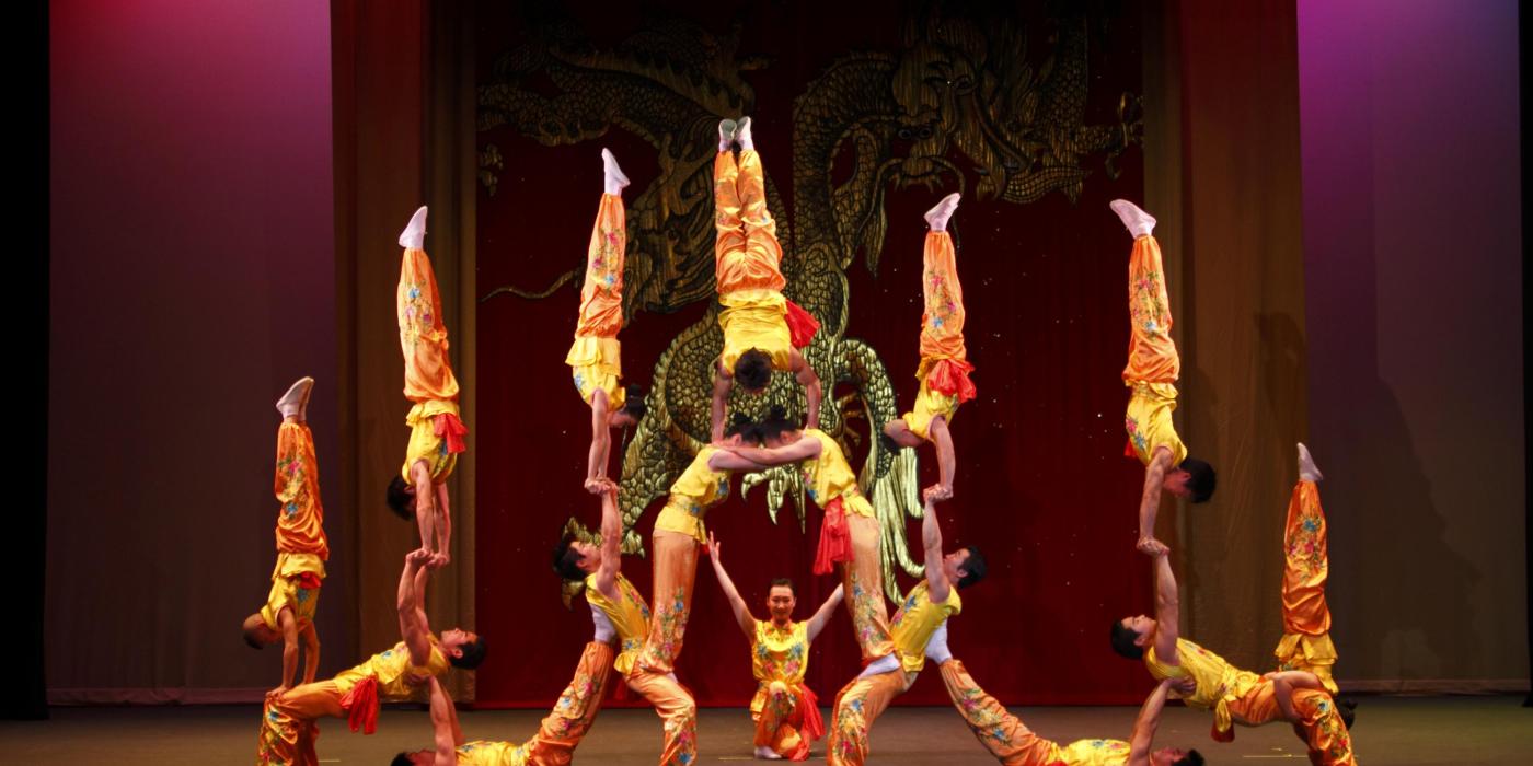 Acrobats creating a human tower.