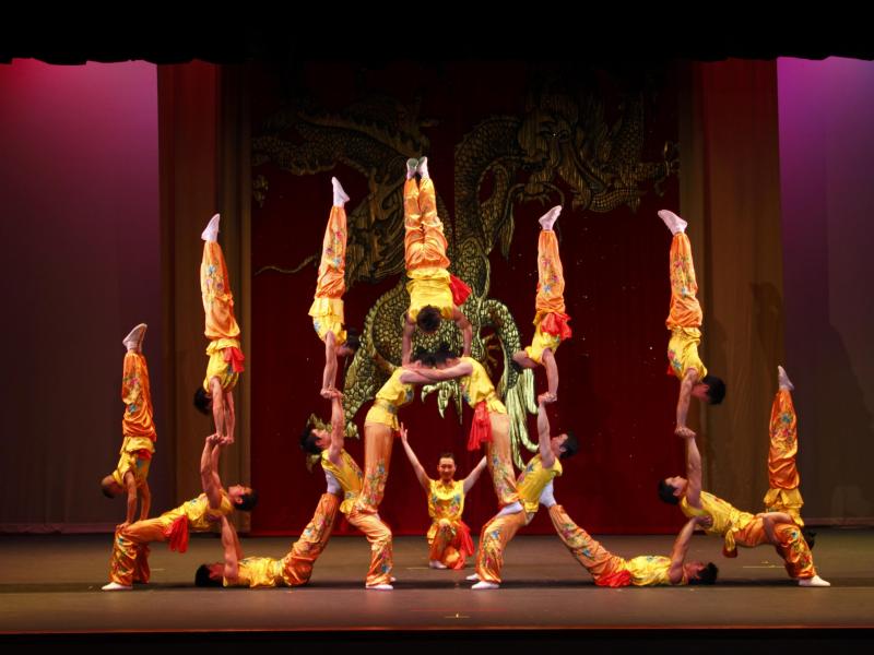 Acrobats creating a human tower.