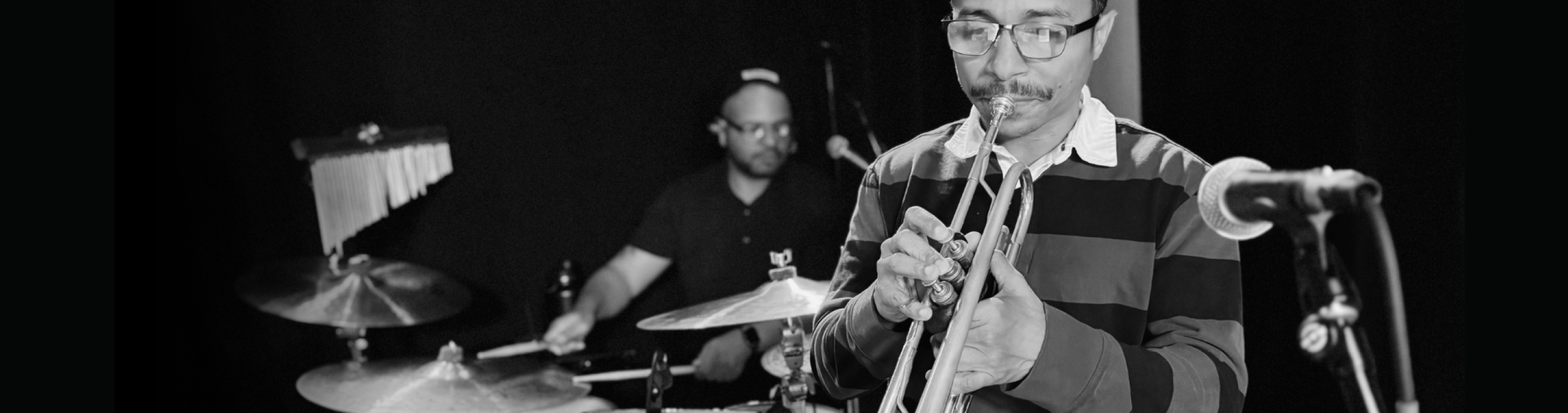 Yellowroot cast playing trumpet and drums